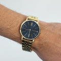 Tommy Hilfiger Daniel Blue Dial Gold Steel Strap Watch for Men - 1710384