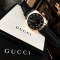 Gucci Black Leather Strap Black Dial Gold Tone Quartz Watch For Women - YA142407