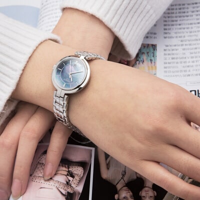 Tissot T Lady Flamingo Mother of Pearl Blue Dial Silver Steel Strap Watch For Women - T094.210.11.121.00